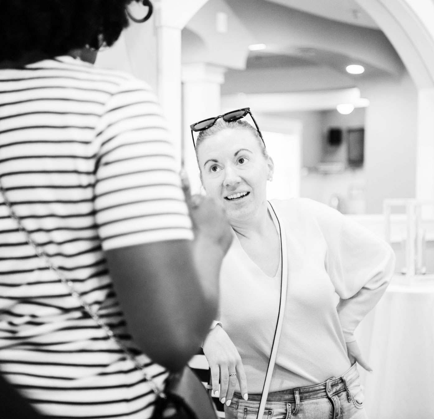 Two colleagues in conversation at a Building Impact Partners gathering